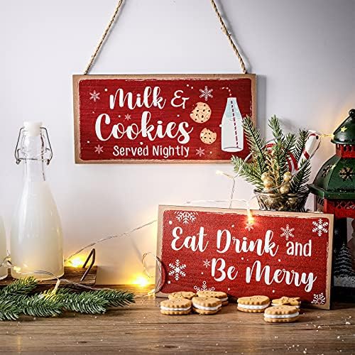 2 חתיכות חג המולד תלויים עץ עץ אוכלים שתייה והיה חלב עליז חלב ועוגיות מוגשות שלט לילי