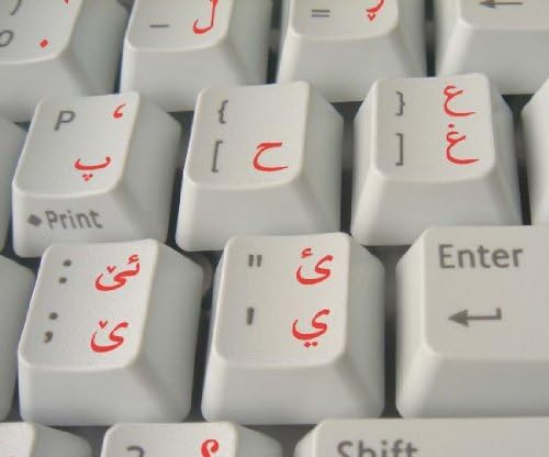 מדבקת מקלדת כורדית עם כיתוב אדום על רקע שקוף לשולחן עבודה, מחשב נייד ומחברת